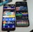Two smartphones are displayed on a white surface, both showing gambling websites with colorful graphics, text, and various options for logging in and accessing games. The screens are bright and filled with promotional content related to casino and slot games.